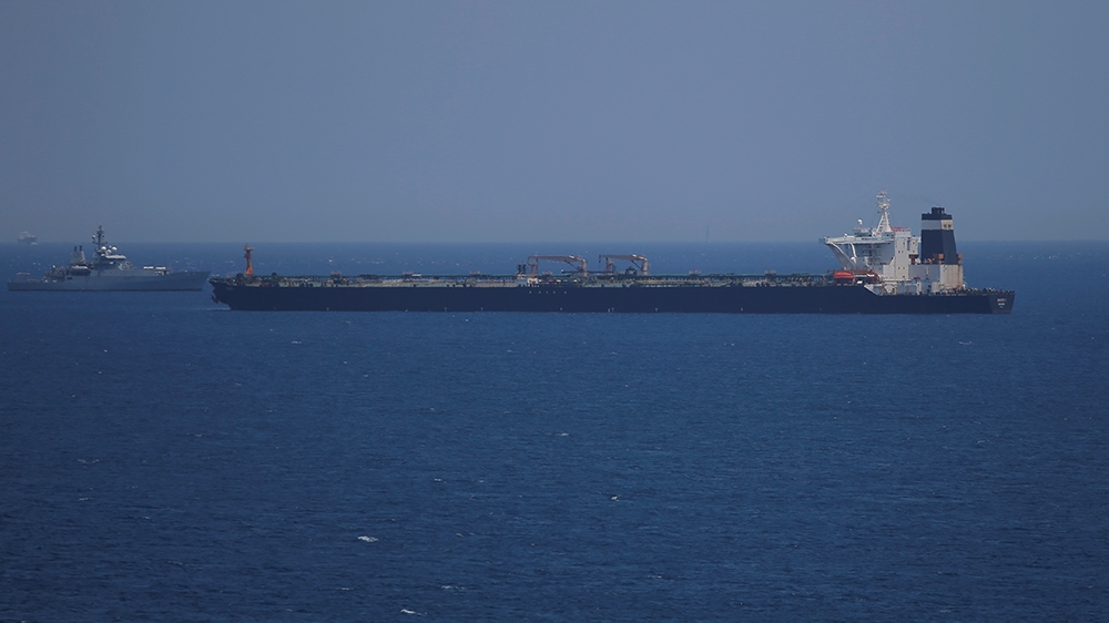 A British Royal Navy patrol vessel guards the oil supertanker Grace 1, that''s on suspicion of carrying Iranian crude oil to Syria, as it sits anchored in waters of the British overseas territory of Gi