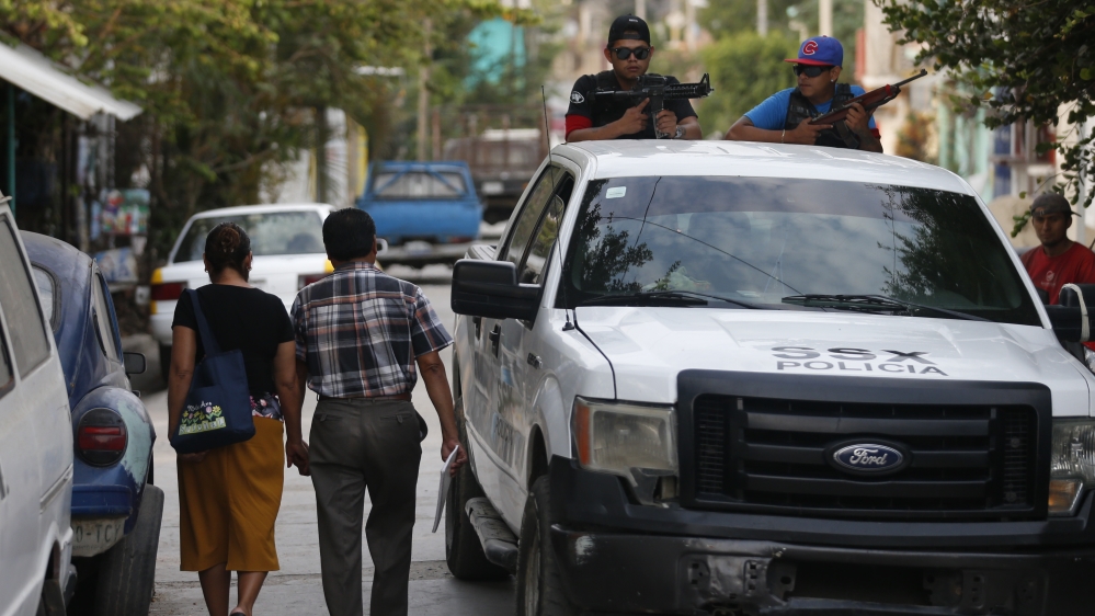 Mexican police and vigilante group