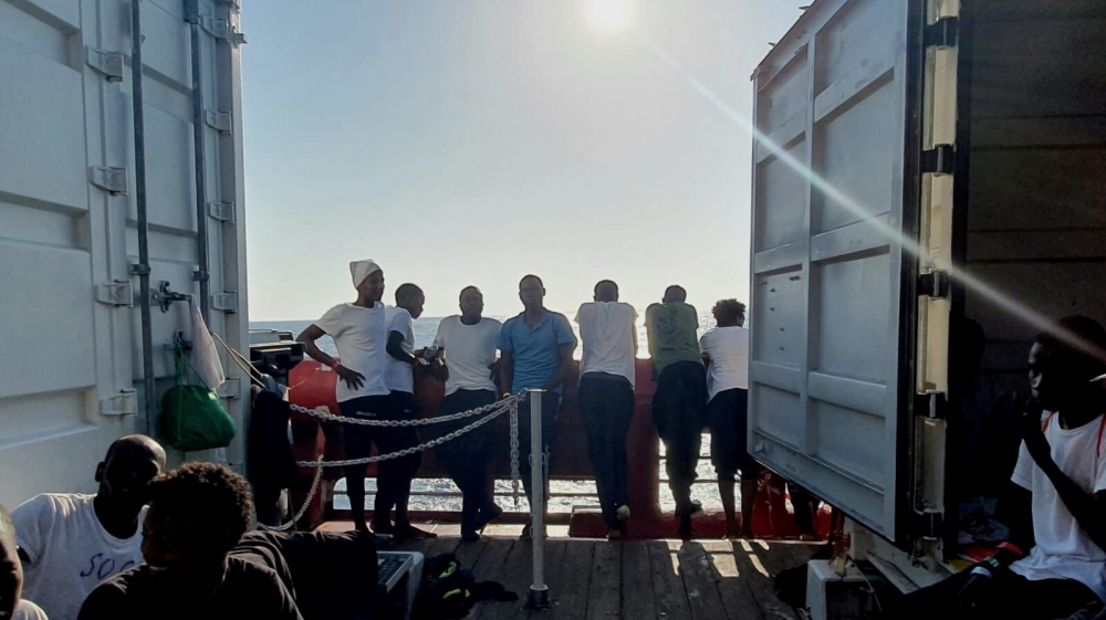 Rescued migrants rest aboard the Ocean Viking, run by French charities Medecins Sans Frontieres and SOS Mediterranee