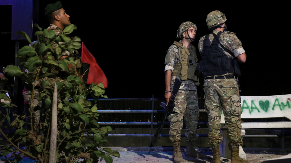 Lebanese army soldiers stand together in Adaisseh village near the Lebanese-Israeli border