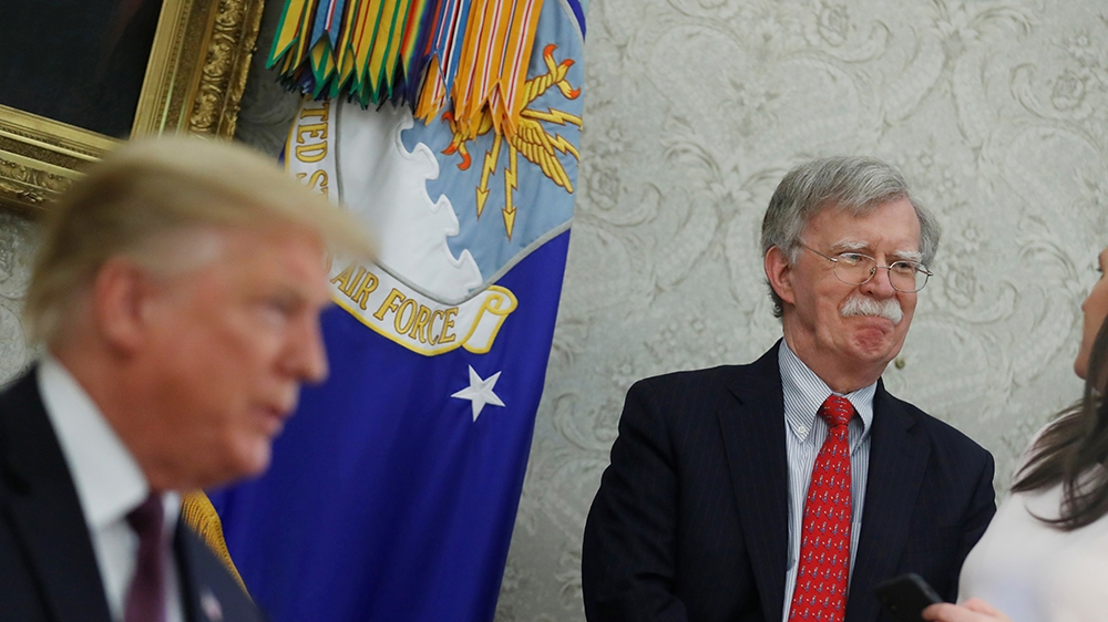 White House national security advisor John Bolton talks with Press Secretary Sarah Huckabee Sanders as U.S. President Donald Trump speaks during meeting with Hungary''s Prime Minister Viktor Orban in t
