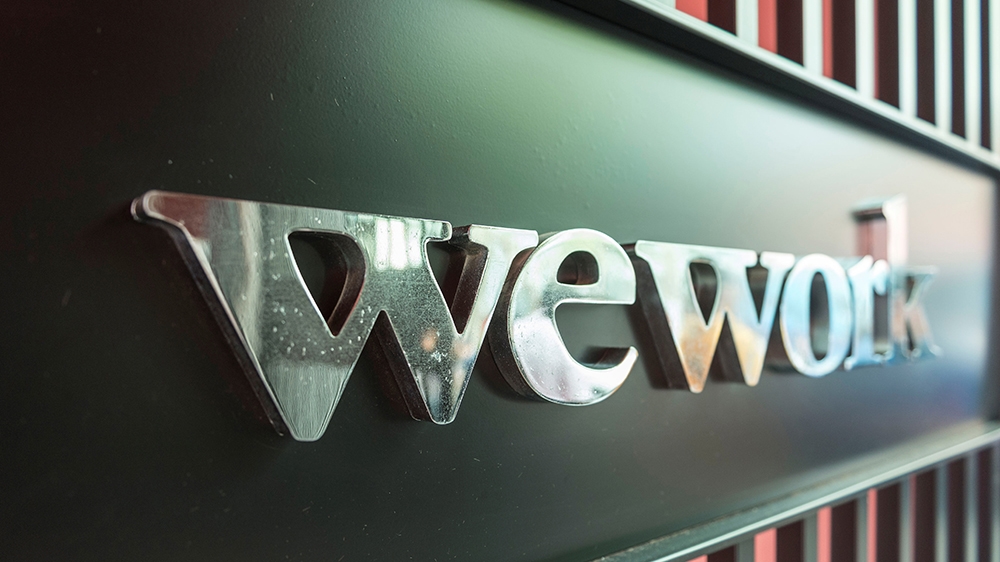Logo of US co-working firm WeWork is pictured during a signing ceremony in Shanghai, China April 12, 2018