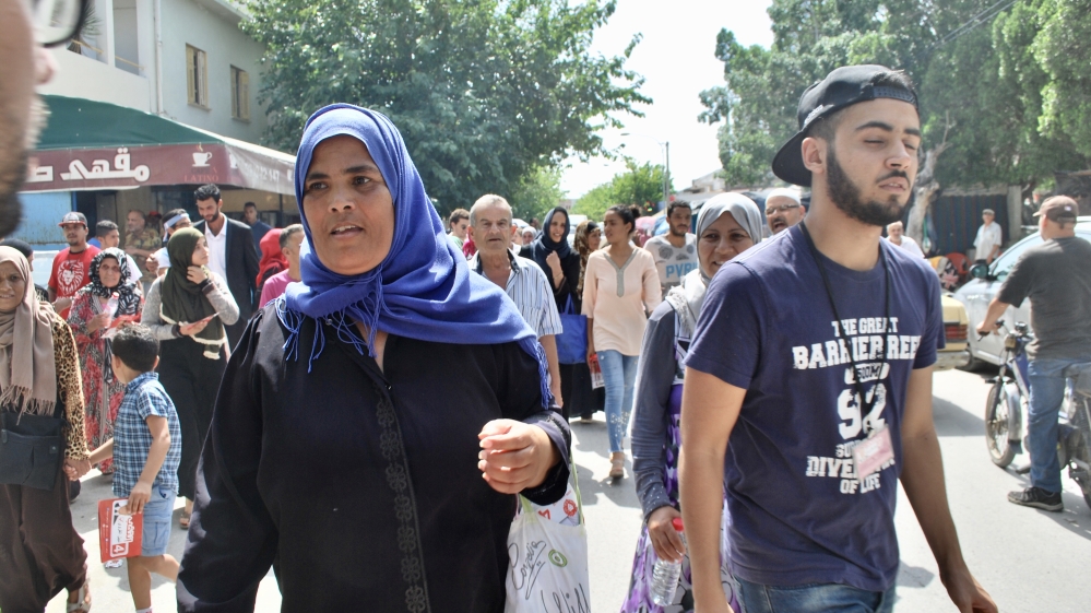 Following a local meeting, the Qalb Tounes procession walk through Menzel Bourguiba