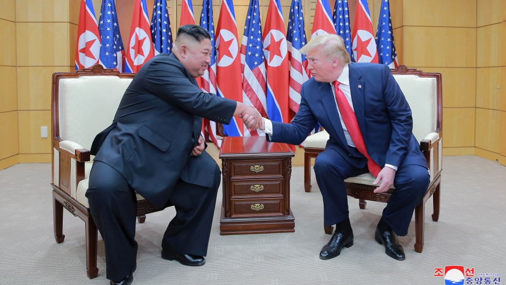 Trump meets with North Korean leader Kim Jong Un at DMZ on border of North and South Korea