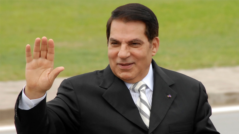 FILE - In this Oct.11, 2009 file photo, then Tunisian President Zine El Abidine Ben Ali waves from his car as he arrives at campaign rally in Rades, outside Tunis.