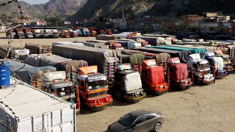 Trucks are parked at Pakistan-Afghanistan border Torkham, Friday, Oct. 19, 2018. Pakistan closed its two official border crossings with Afghanistan, the foreign ministry said. The development came at