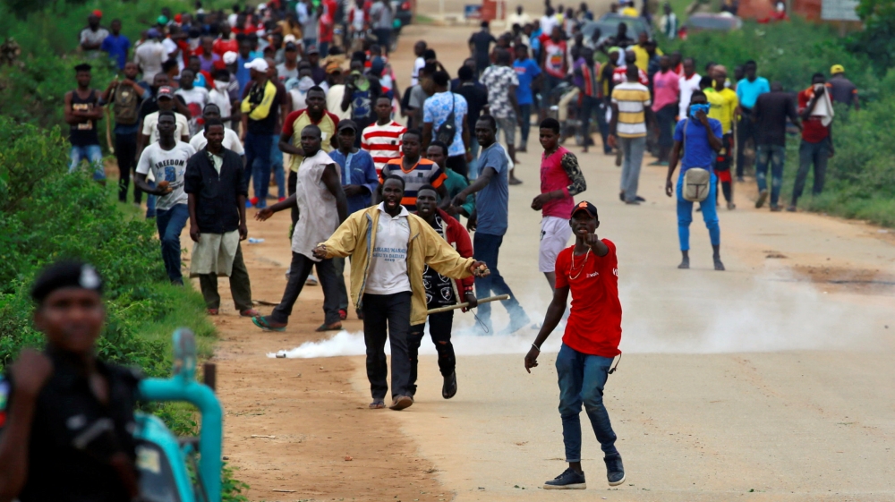 Protesters walk towards the police during a protest in Abuja