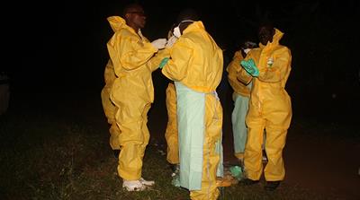 Health workers dress up in protective gear at Bwera Hospital near Mpondwe, Uganda near the border with the DRC