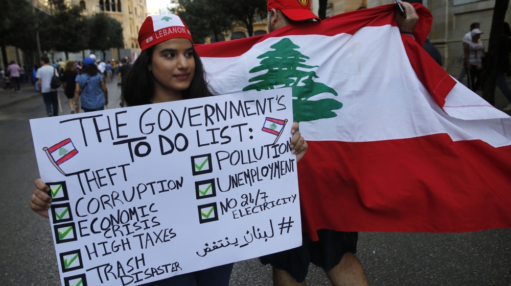 Protesters hold banners during a demonstration in Beirut, Lebanon