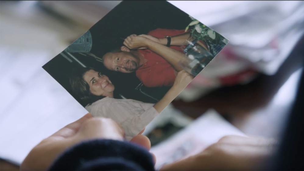 Sue Cassinelli shows Al Jazeera a picture of her and her late husband, Tim Murphy – who died by suicide in 2015 after years of struggling with the trauma of alleged abuse at the hands of Father Donald Timone