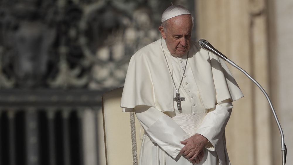 Pope Francis prays