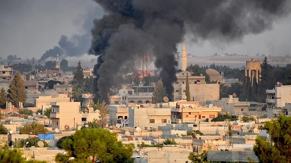 SANLIURFA, TURKEY - OCTOBER 09: A photo taken from Turkey''s Sanliurfa province, on October 09, 2019 shows smoke rises at the site of Ras al-Ayn city of Syria as Turkish troops along with the Syrian Na