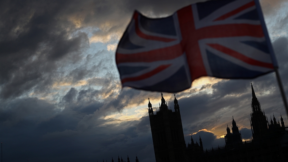 A Union Jack flag flutters in front of the Houses of Parliament in London, Britain, November 5