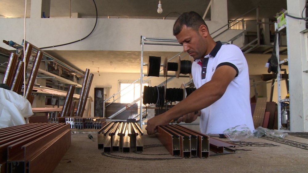 Luai al-Ashqar spent 26 months in jail for transferring wanted Palestinians and entering Israel without a permit [Al Jazeera]