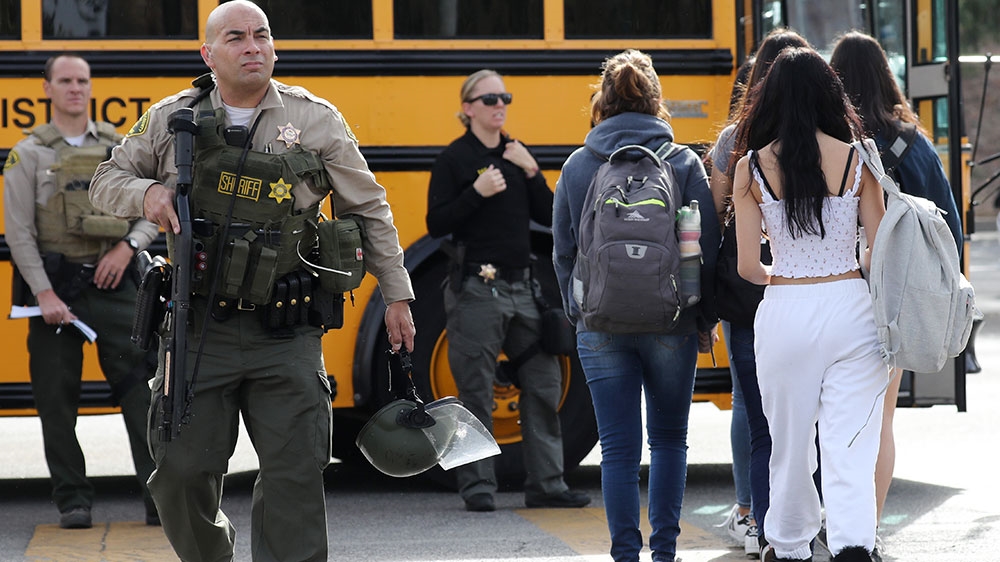 Students are evacuated from Saugus High School after a shooting at the school left two students dead and three wounded