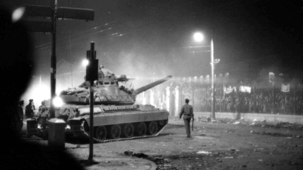 A November 17, 1973 picture shows an army tank preparing to drive through the gates of the student-occupied Polytechnic Institute in Athens