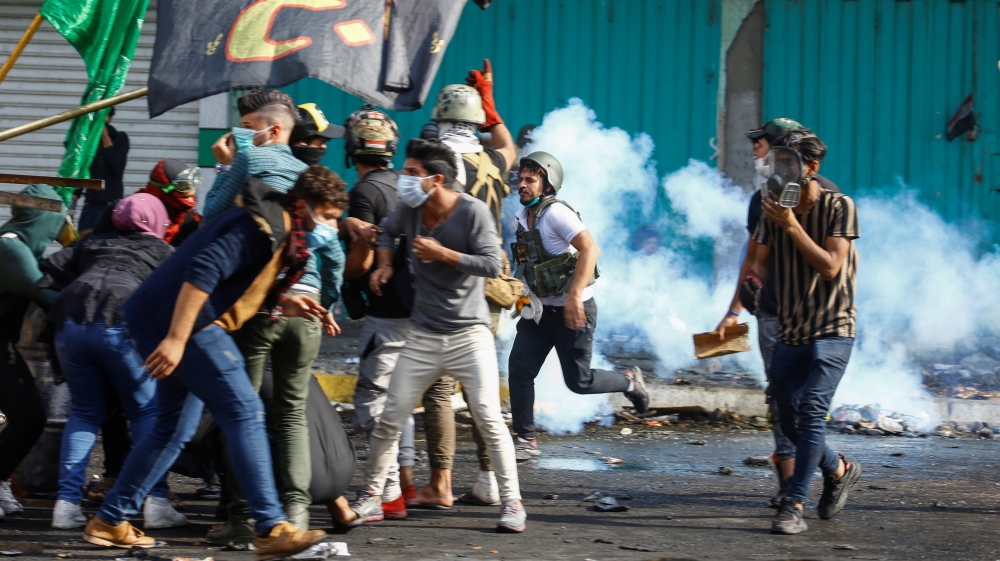 Iraqi demonstrators take part in ongoing anti-government protests in Baghdad