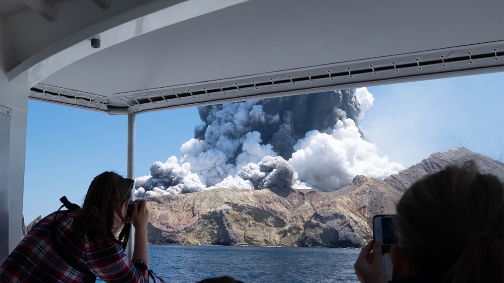 This handout photograph courtesy of Michael Schade shows the volcano on New Zealand''s White Island spewing steam and ash moments after it erupted on December 9, 2019. New Zealand police said at least