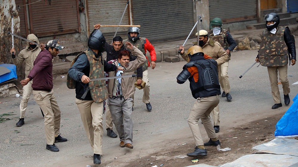 Police officers detain a demonstrator during a protest against a new citizenship law in Seelampur, area of Delhi, India  December 17, 2019. REUTERS/Danish Siddiqui