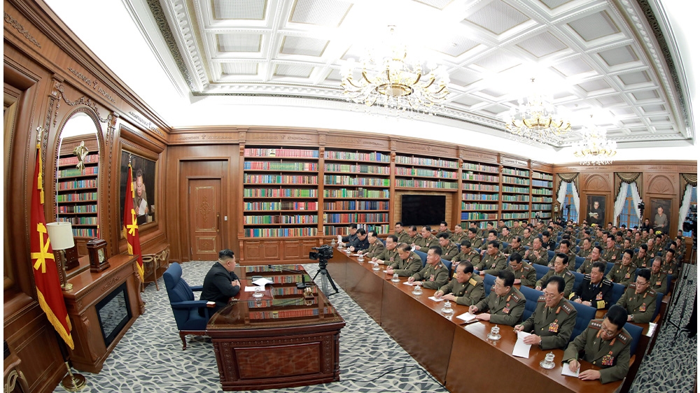 KCNA shared undated photos of North Korea’s leader Kim Jong Un speaking to the country’s top military officials as the North increases pressure on the US to make concessions in exchange for the resumption of nuclear talks [KCNA via Reuters]
