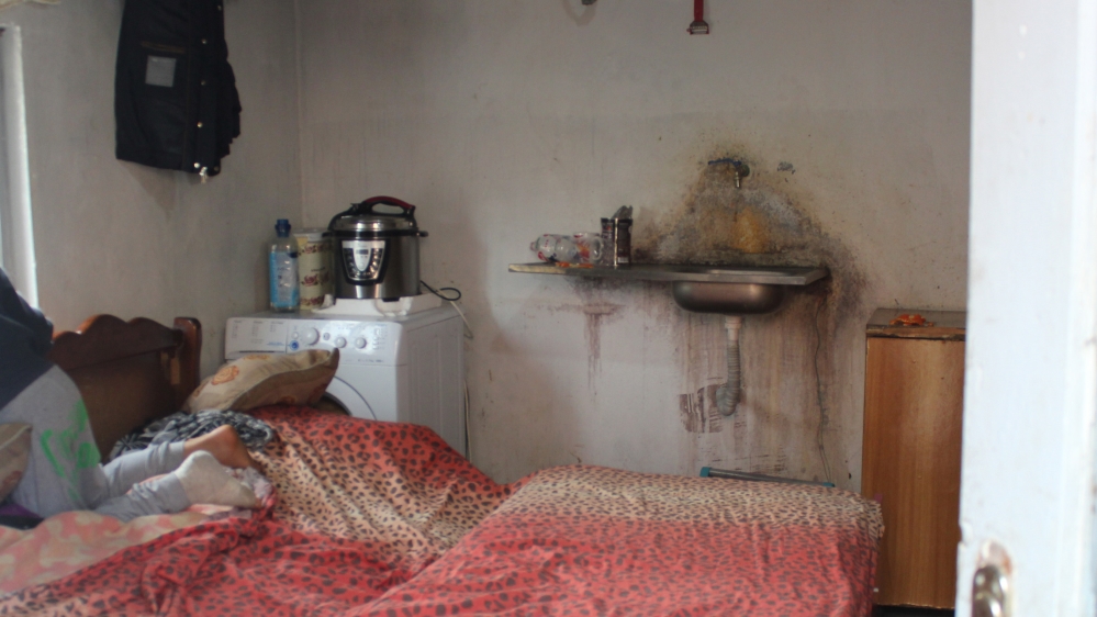 Irina Doci lives in a shabby hut in the garden with her children to avoid danger in case of further aftershocks