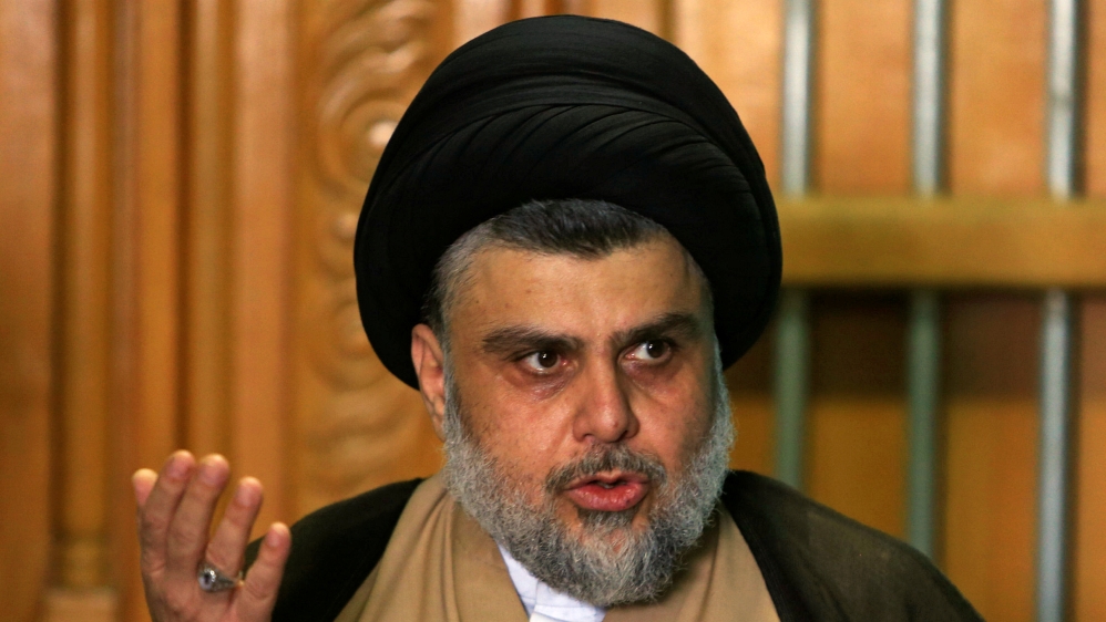 Iraqi Shi''ite cleric Moqtada al-Sadr speaks during a news conference with Iraqi politician Ammar al-Hakim, leader of the Hikma Current, in Najaf