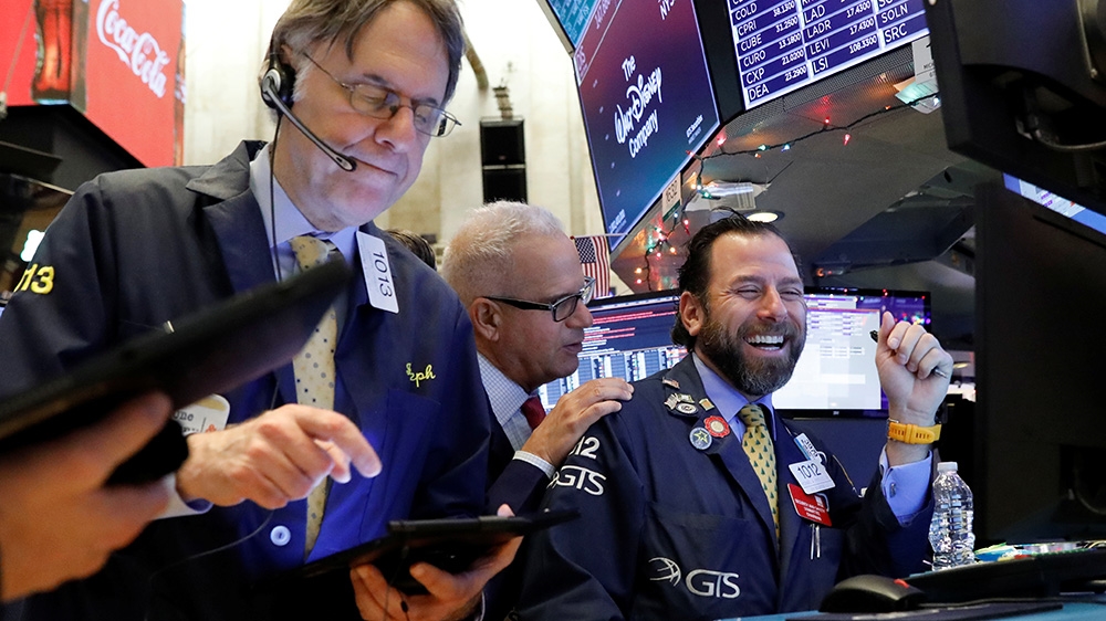 Traders work on the floor at the New York Stock Exchange (NYSE) in New York, U.S., December 9, 2019