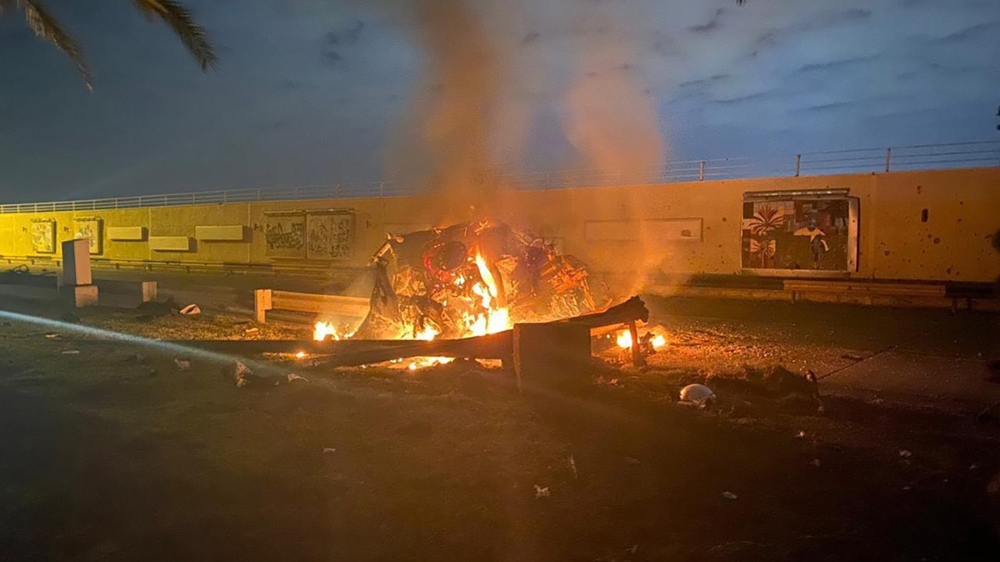 This photo released by the Iraqi Prime Minister Press Office shows a burning vehicle at the Baghdad International Airport following an airstrike in Baghdad, Iraq. [AP Photo]