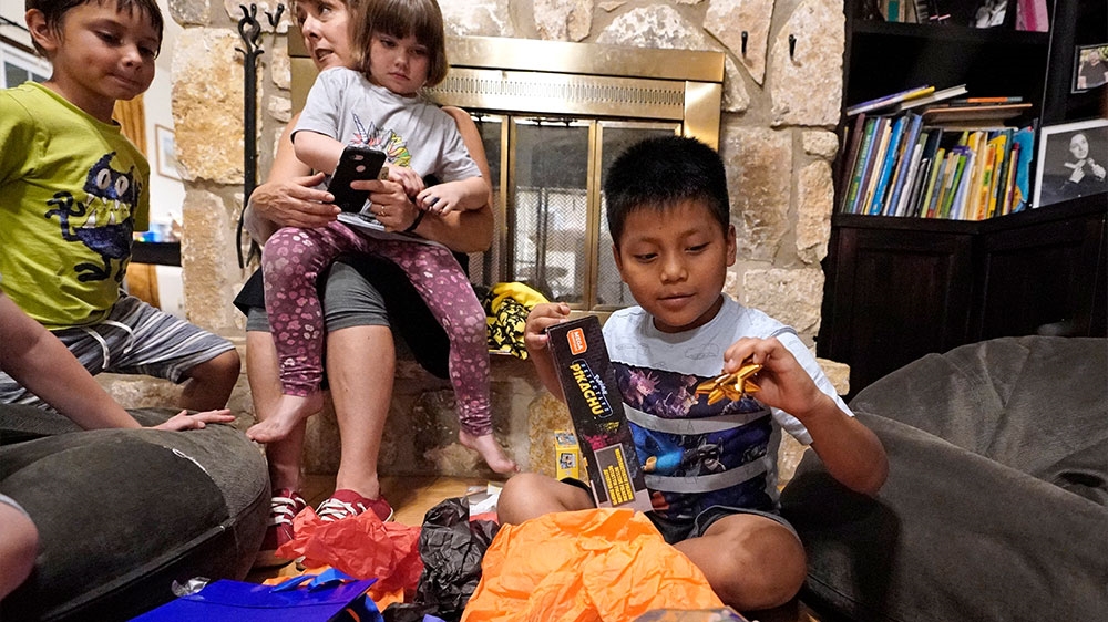 Byron Xol, an immigrant from Guatemala, opening gifts during his birthday party in Buda, Texas. Byron was separated from his father, David Xol-Cholom in May 2018, during the Trump’s administration wide-scale separation of immigrant families