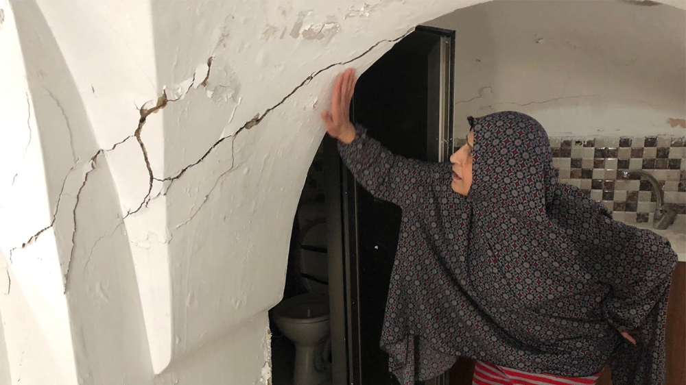 Large cracks have appeared on the walls and ceilings of Hanan Slaima’s home in the past month