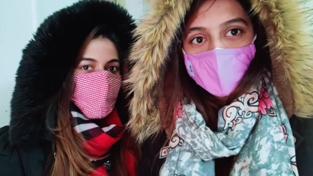 The Khan sisters, Chinese-language students from Pakistan, told Al Jazeera that they were not worried about remaining in Wuhan [YouTube Screengrab]