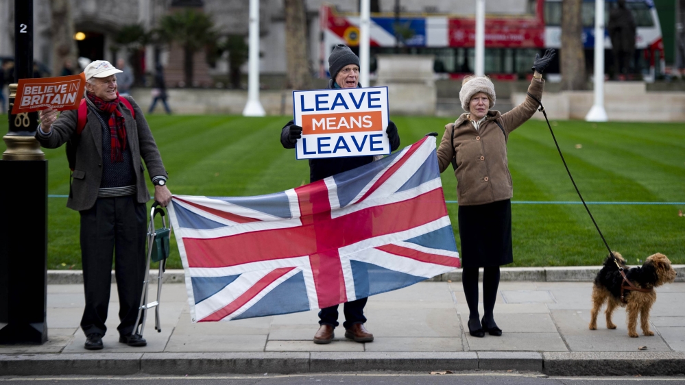 Pro-Brexit protesters stand outside the Houses of Parliament in London, January 14, 2019