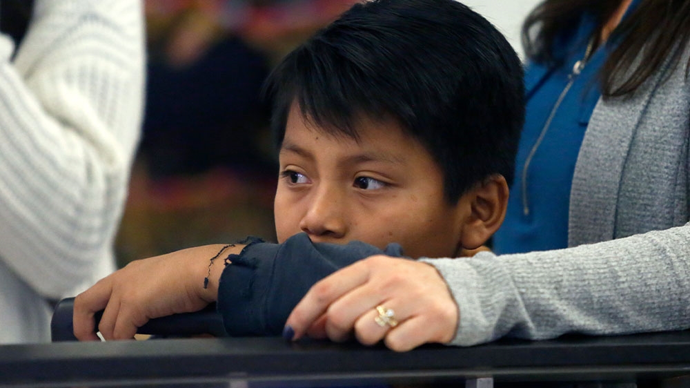 Byron Xol waiting for his father at Los Angeles International Airport as they reunite after being separated about one and half years ago during the Trump administration’s wide-scale separation of immigrant families