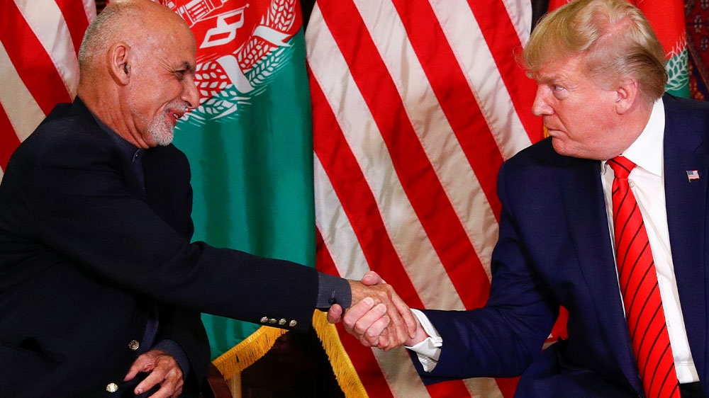US President Donald Trump shaking hands with Afghanistan President Ashraf Ghani during a surprise visit at Bagram Air Base in Afghanistan