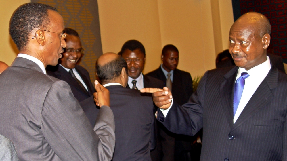 UGANDAN PRESIDENT MUSEVENI JOKES WITH RWANDAN COUNTERPART KAGAME DURING SUMMIT ON BURUNDI IN DAR ES SALAAM. The Chairman of the Great Lakes countries Ugandan President Yoweri Museveni (R) jokes with