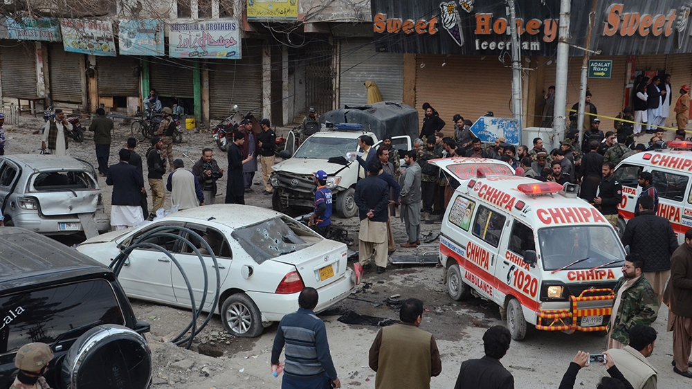 epa08223847 Pakistani security officials inspect the scene of a bomb blast in Quetta, Pakistan, 17 February 2020. According to reports, at least 10 people were killed and more than 30 injured when a b