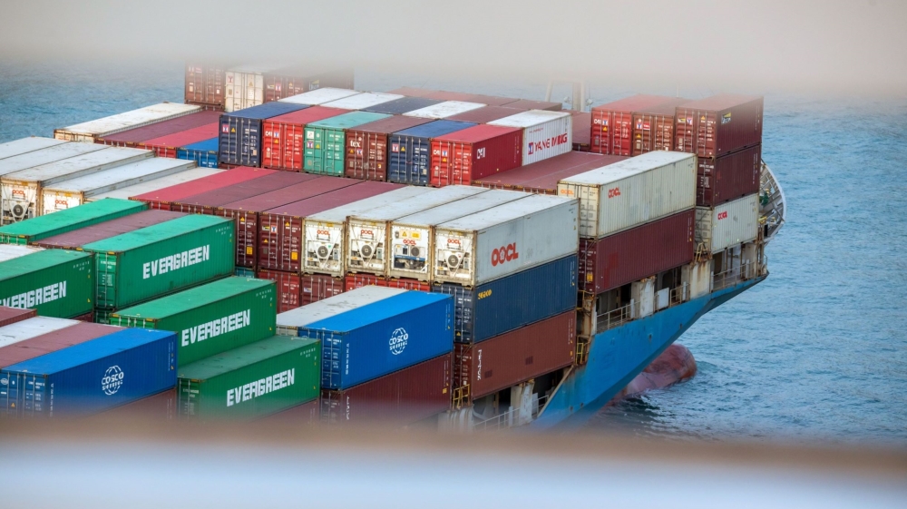 A container ship sails near the Kwai Tsing Container Terminal in Hong Kong, China, where the coronavirus outbreak has shut down factories