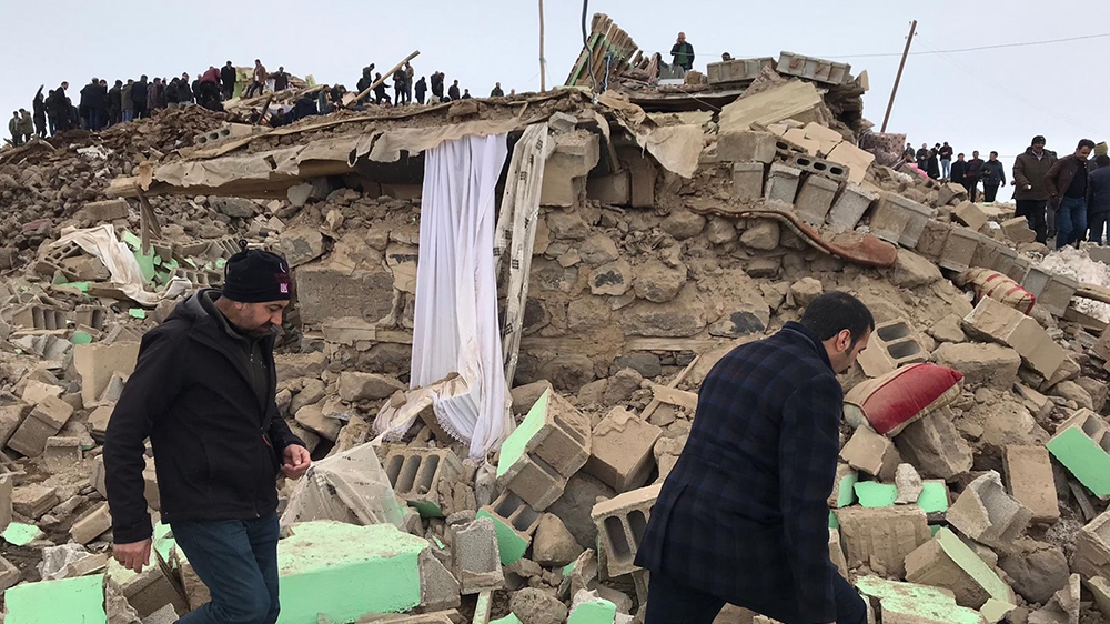 VAN, TURKEY - FEBRUARY 23: Crews and locals conduct search and rescue works at the site of collapsed buildings after a magnitude-5.9 earthquake struck near the border with Iran, in Ozpinar neighbourho