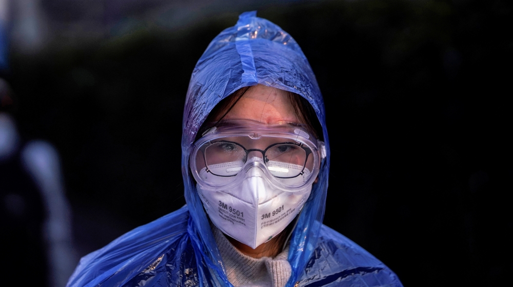 A passenger wearing a mask walks at the Shanghai railway station in China, as the country is hit by an outbreak of the novel coronavirus, February 9, 2020. REUTERS/Aly Song