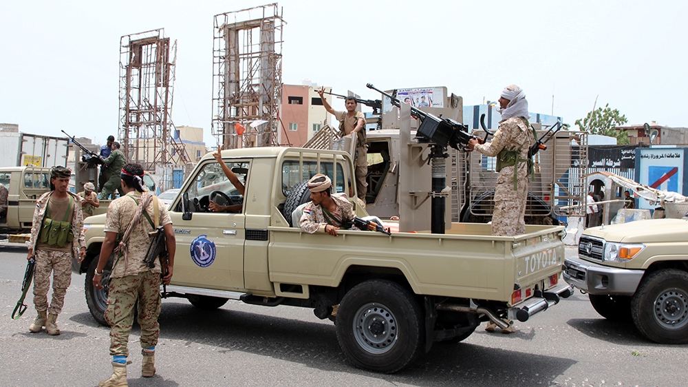 Members of UAE-backed southern Yemeni separatist forces patrol a road during clashes with government forces in Aden on August 10, 2019