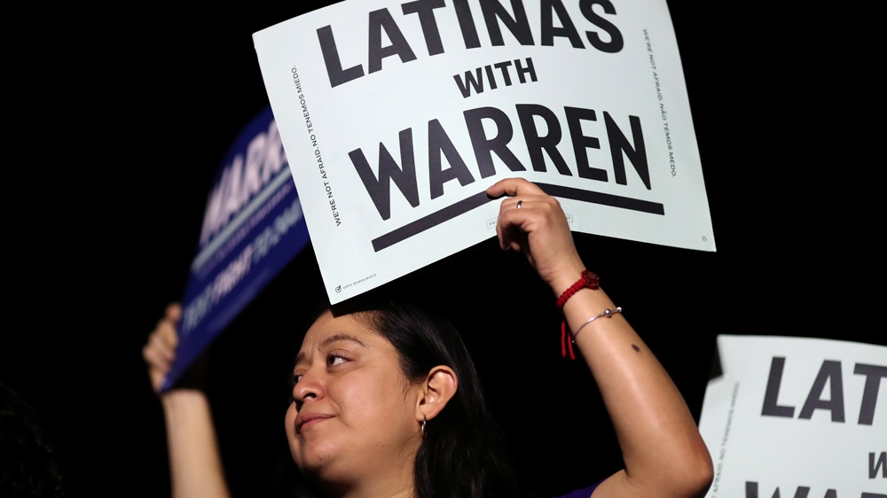Supporters listen as US Democratic Presidential Candidate Elizabeth Warren speaks at a rally at East Los Angeles College in Los Angeles