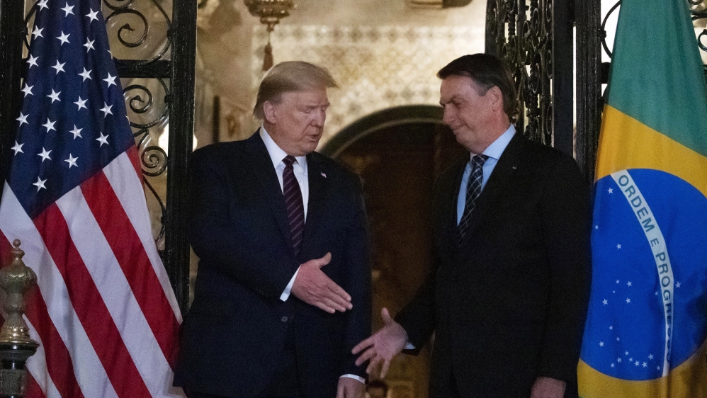 President Trump shakes hands before dinner with his Brazilian counterpart Bolsonaro at Mar-a-Lago in Palm Beach, Florida earlier this month