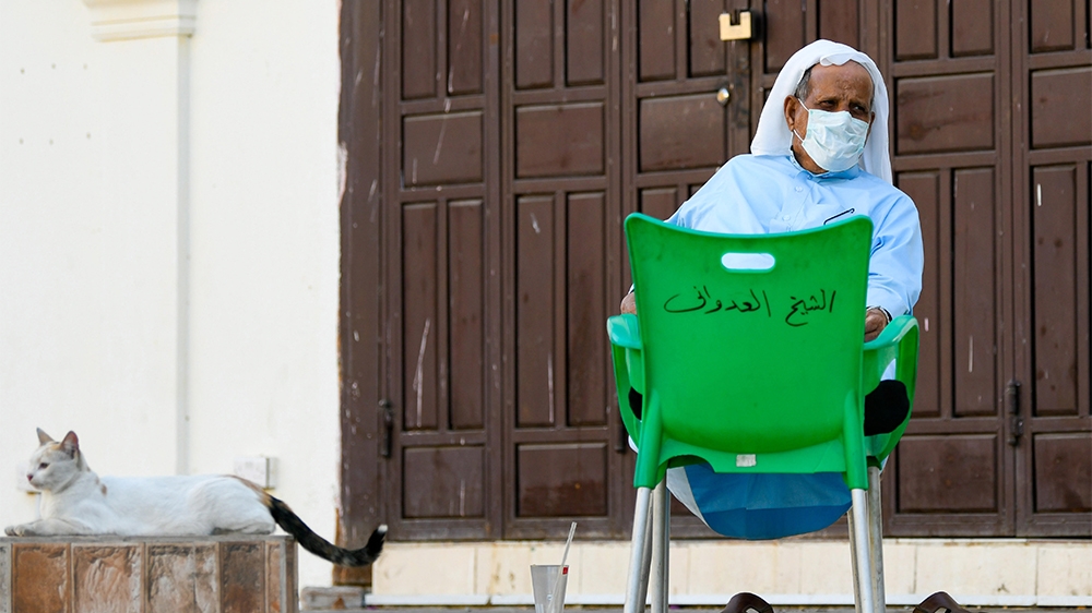An elderly man wearing a protective mask sits in front of a closed shop Jeddah, Saudi Arabia, 24 March 2020. According to local media reports Saudi Arabia has registered 51 new cases on 23 March bring