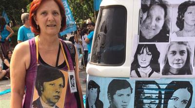 Ofelia Agorio, on March 24, 2016 in Buenos Aires, Argentina, wearing a photo of her disappeared brother Nelson [Courtesy of Ofelia Agorio] [Daylife]