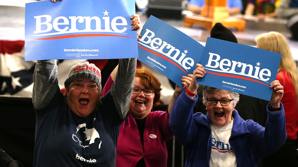 Supporters of US Democratic presidential candidate Bernie Sanders cheer at his Super Tuesday election night rally in Essex Junction, Vermont