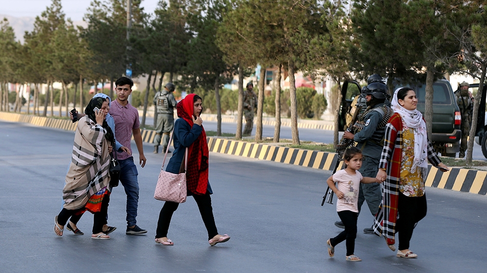 A family leaves the site of a powerful blast in Kabul, Afghanistan July 28, 2019. REUTERS/Omar Sobhani