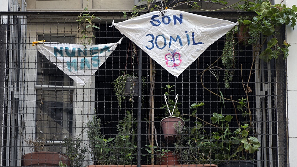 A balcony is decorated with white handkerchiefs during 44th anniversary of the 1976 coup in Buenos Aires, Argentina
