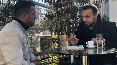 Asib Zekir of REDI, right, discusses the plan to legitimise recycling collection in the eyes of the government with Roma collector Sabuhan