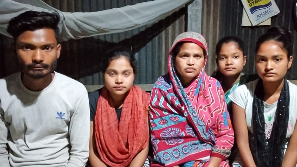 Hazrat Ali (L), the eldest of five siblings, hopes the court will release his father until the situation becomes normal