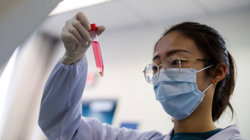 A scientist works in the lab of Linqi Zhang on research into novel coronavirus disease (COVID-19) antibodies for possible use in a drug at Tsinghua University in Beijing